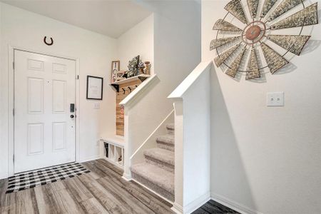 Luxury Vinyl Plank floors throughout the ground floor were added by the home owner along with the custom drop zone in the entry way.