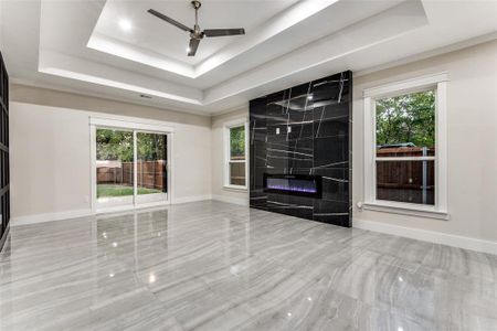 Breathtaking Living Room with upgraded tiles, double boxed ceiling!