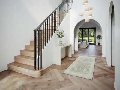 Stairs with a high ceiling and parquet floors