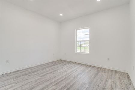 Spare room featuring light hardwood / wood-style floors