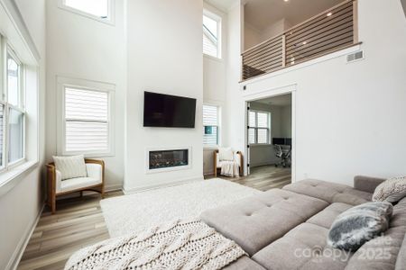 The double-height ceiling adds openness and plenty of natural lights