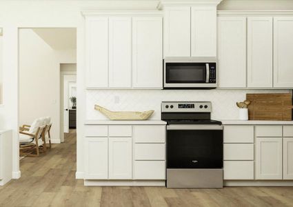 Rendering of Kitchen with
  white cabinets and stainless-steel appliances.Â