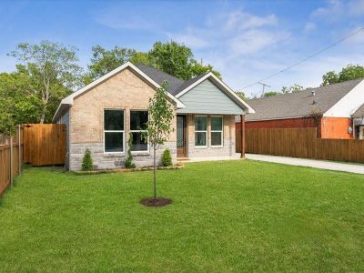 Rear view of property with a lawn