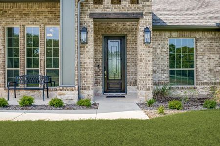 Doorway to property with a yard