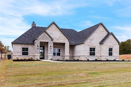 French provincial home with central AC unit and a front lawn