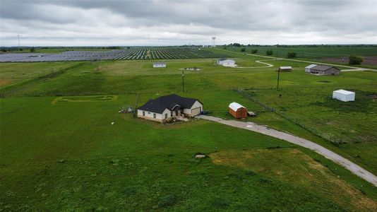 Birds eye view of property featuring a rural view