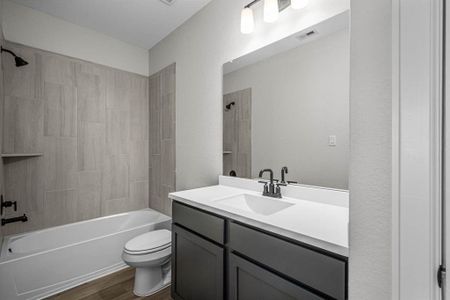 The secondary bathroom is centrally located in the home.