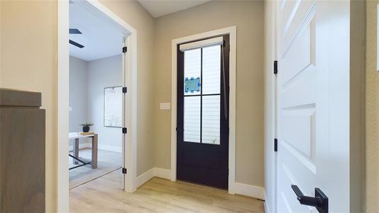 As you enter, you're greeted by a beautifully designed foyer with a stylish modern door and elegant finishes that set the tone for the rest of the home. Every detail is crafted for both aesthetics and function.