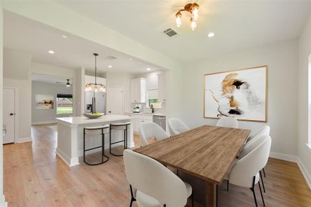 Dining Area is open to the kitchen with large quartz island with sitting area!*Virtually Staged*