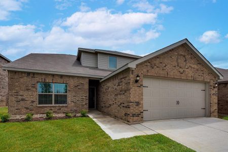 View of front facade with a garage and a front lawn