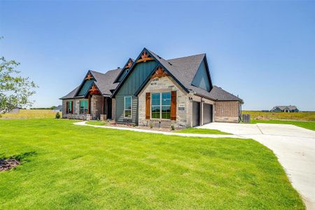 Craftsman house with a front lawn