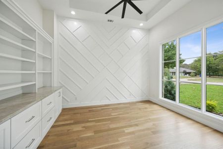 Office off Entry with wall of Pella Windows looking out; Frosted French doors for privacy off Entry