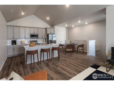 Virtually staged example of kitchen and dining room