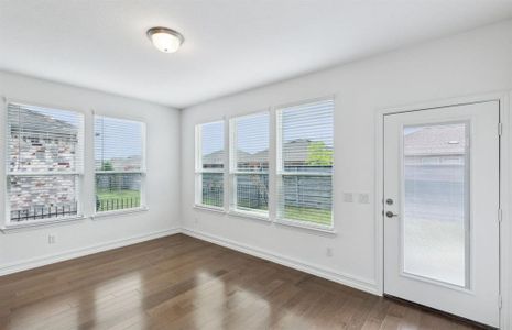 Spacious gathering room with large windows *real home pictured