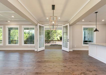 Dining area off the kitchen with wood floors.