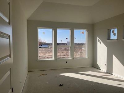 Empty room featuring baseboards