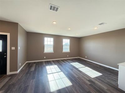 Spare room featuring dark hardwood / wood-style flooring