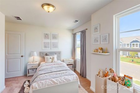 Secondary bedroom shown with virtual staging