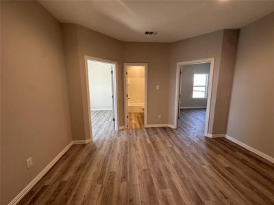 Unfurnished room with hardwood / wood-style flooring