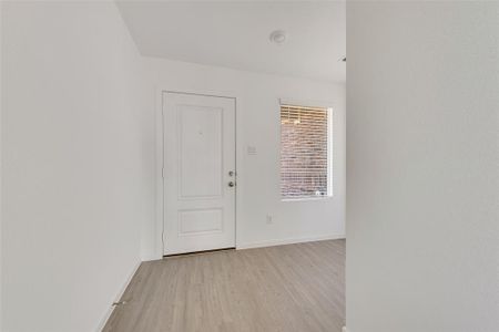 Empty room featuring light hardwood / wood-style flooring