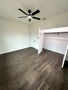 Unfurnished bedroom with ceiling fan