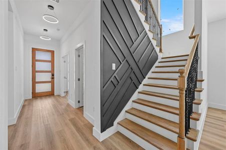 Entrance foyer with light wood-type flooring