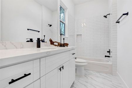 The first floor bathroom features a combo tub and shower. (Model Unit 9424C)