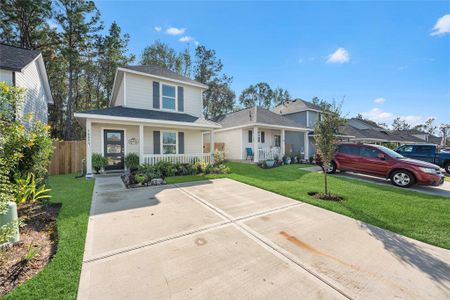 The home has updated landscaping and a cozy front porch.