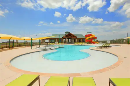 View of pool featuring a patio area and a water slide