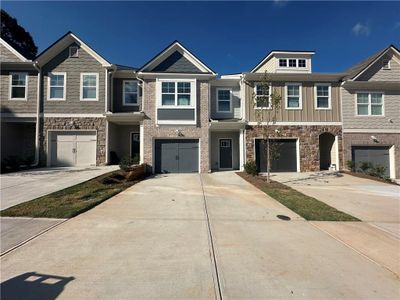 New construction Townhouse house 5736 Calle Vista Drive, Lithonia, GA 30058 - photo 0