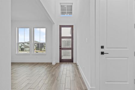 Foyer with a towering ceiling