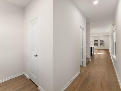 Corridor featuring hardwood / wood-style floors