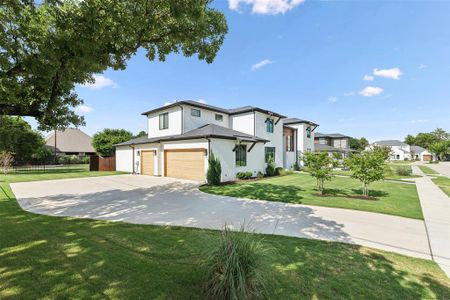 View of front of home with a garage and a front yard