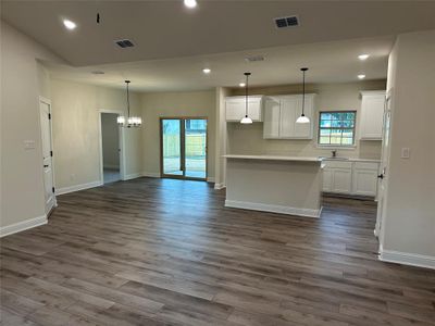 This open concept home features Luxury Vinyl Plank flooring plenty of light and room for any size family.