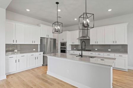 Beautiful, sleek cabinets with black iron hardware.