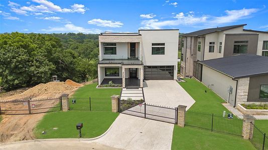 Modern home with a garage and a front yard