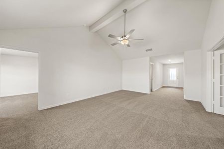 Carpeted empty room with baseboards, visible vents, ceiling fan, beamed ceiling, and high vaulted ceiling