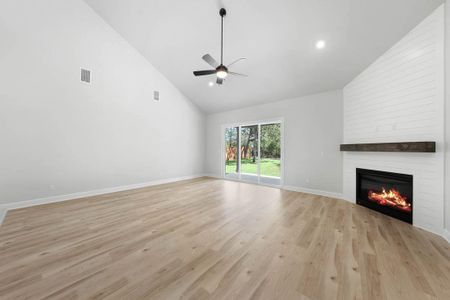 Spacious, open floorplan with a beautiful fireplace in the liviing room.