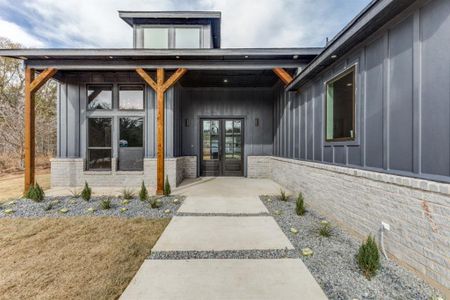 View of exterior entry featuring french doors