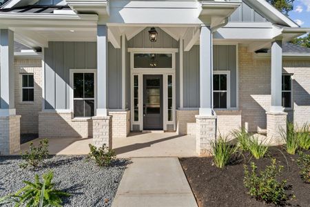 Covered Front Porch and Beautiful Landscaping!