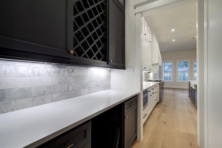 Butlers pantry connecting formal dining room and kitchen