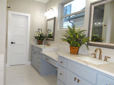 Master Bathroom with double vanity and tile floors