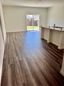 Spare room with sink and dark hardwood / wood-style flooring