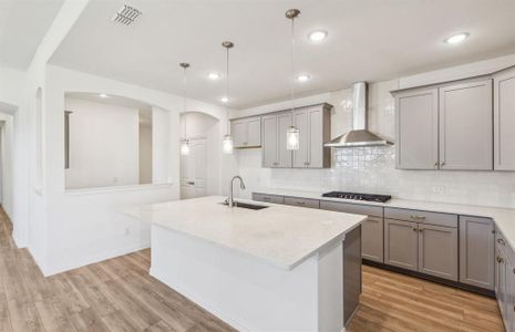 Bright kitchen with oversized island *real home pictured