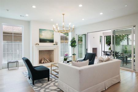 Living room featuring wood-type flooring and a chandelier