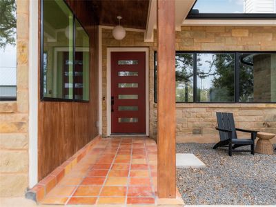 Thoughtfully crafted, this new construction pays homage to classic MCM architecture with clean lines, expansive windows, and open-concept living spaces, all while incorporating the latest in modern amenities. Before entering, notice the Cherokee Red front door, an ode to Frank Lloyd Wright's signature color.