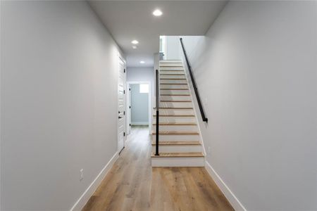 Entrance to office, bedroom and stairs to main living floor