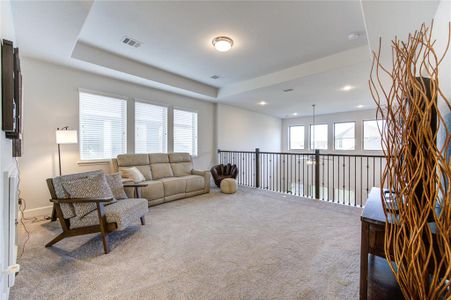 Expansive second-floor game room offers endless entertainment possibilities.