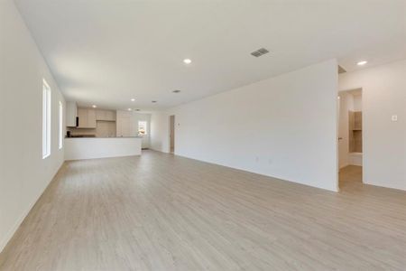 Unfurnished living room featuring light hardwood / wood-style flooring