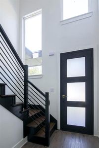 Foyer entrance featuring dark hardwood / wood-style floors